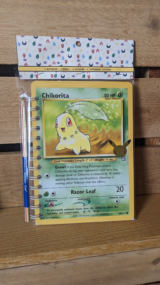 Pokémon card notebooks are packaged with a pencil, two random stickers, and two random temporary tattoos.